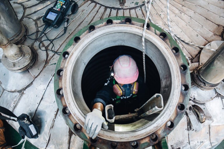 worker in tank manway